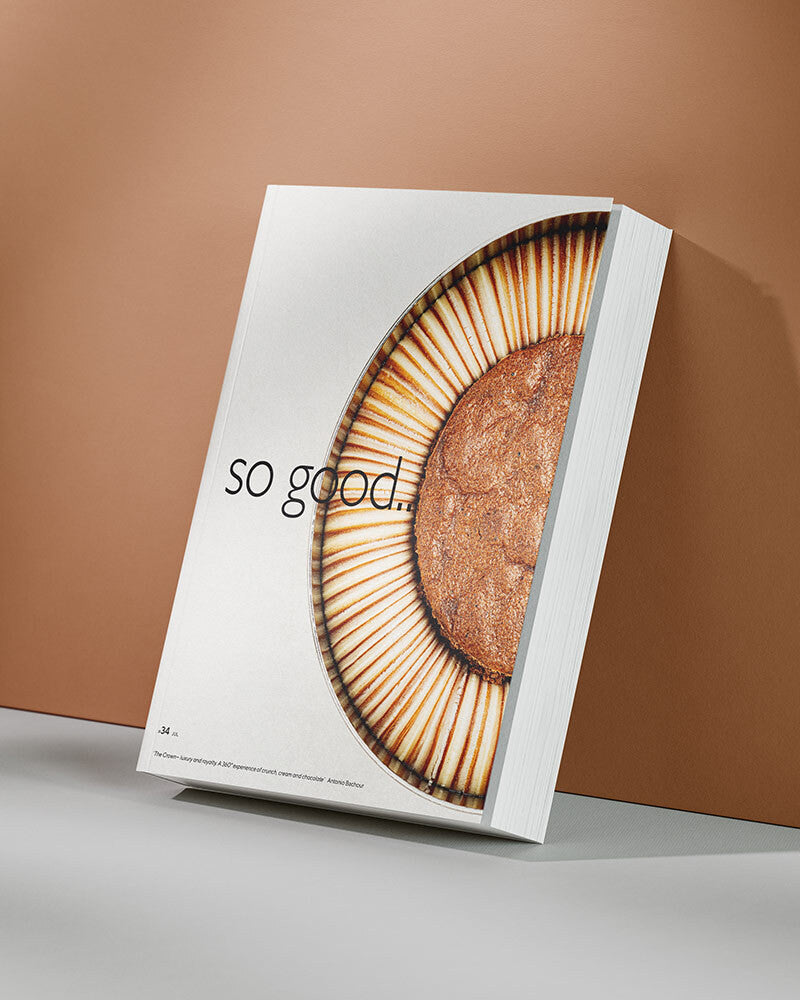 Book titled 'so good' with a close-up of a cake on the cover against a brown background