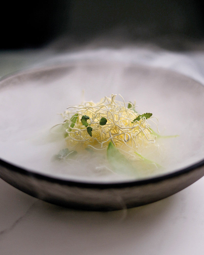 Delicate dish with plated dessert on a white plate