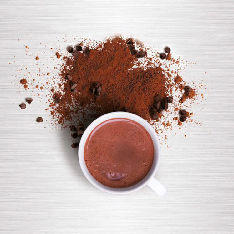 Cup of hot chocolate with hot chocolate mix and chocolate chips on a white background