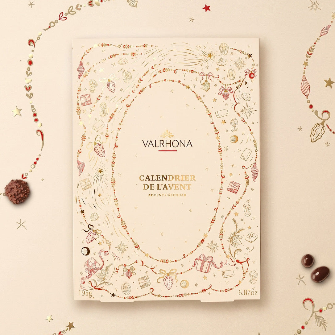 A Valrhona Advent Calendar titled 'Calendrier de l'Avant' displayed on a warm beige background decorated with festive illustrations and chocolate pieces.