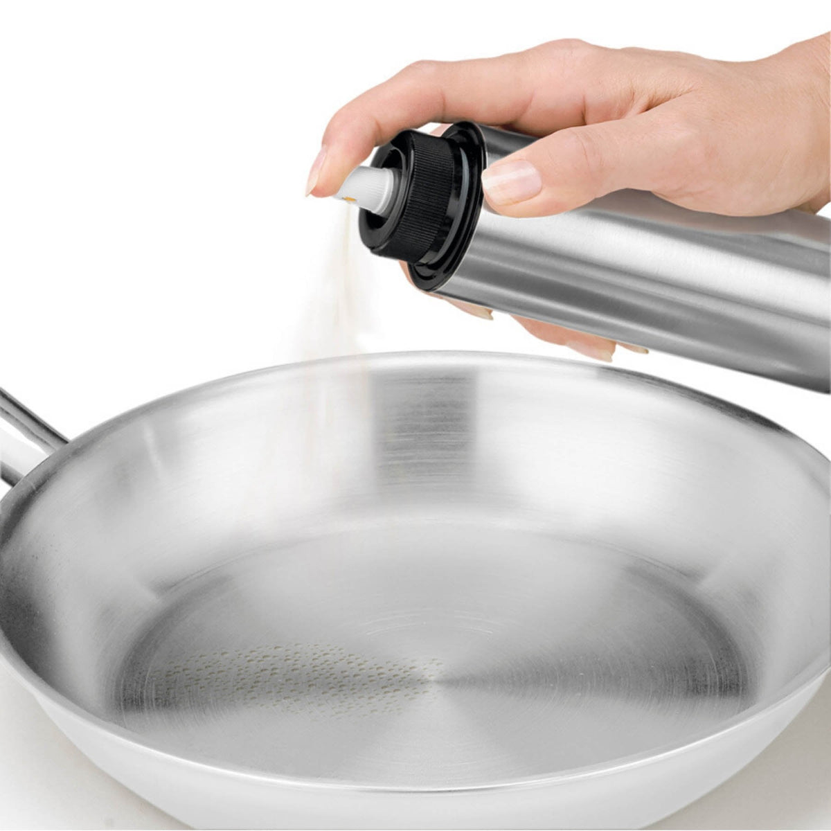 CUISIPRO Oil Sprayer used on a pan